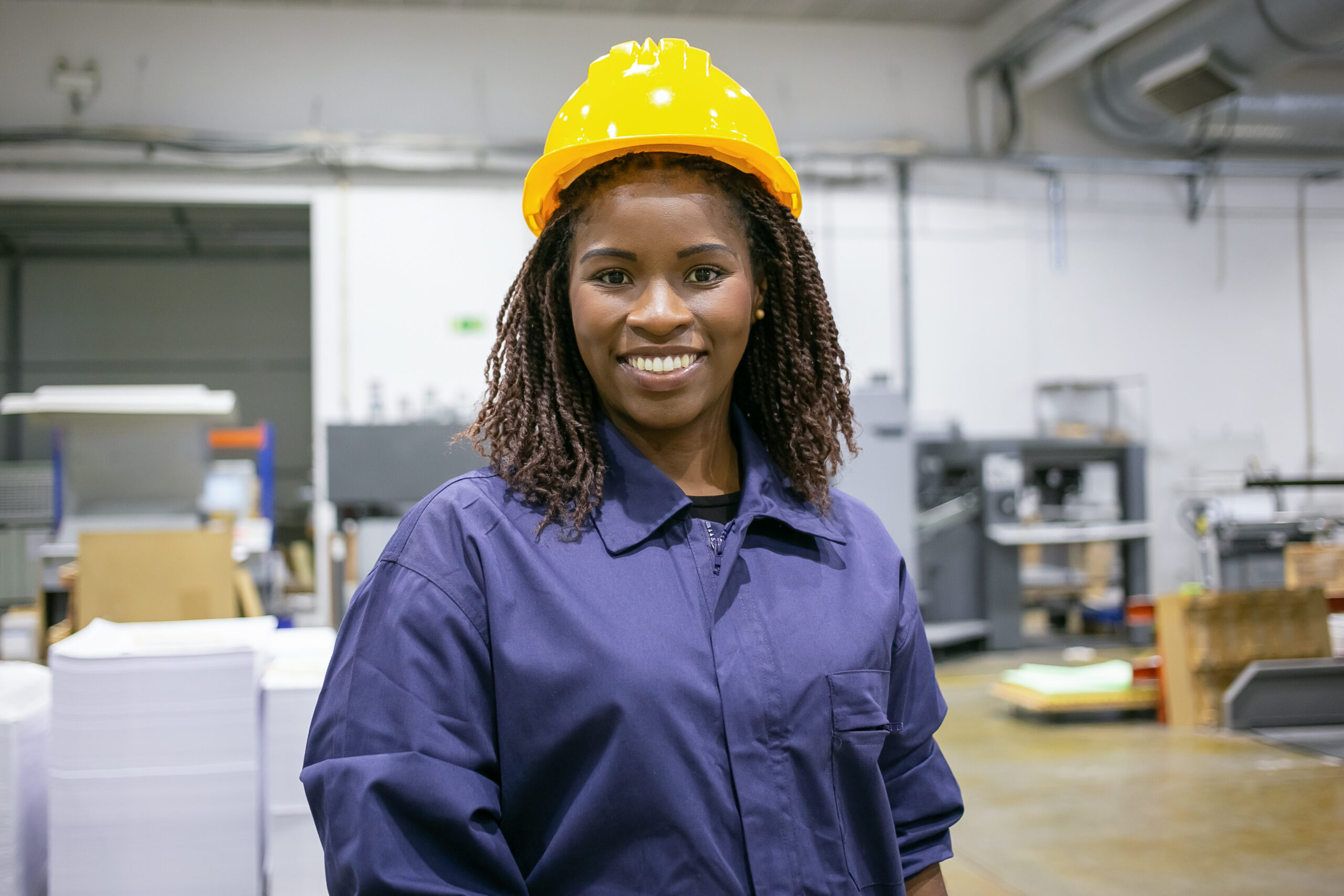 Cheerful African American female factory employee